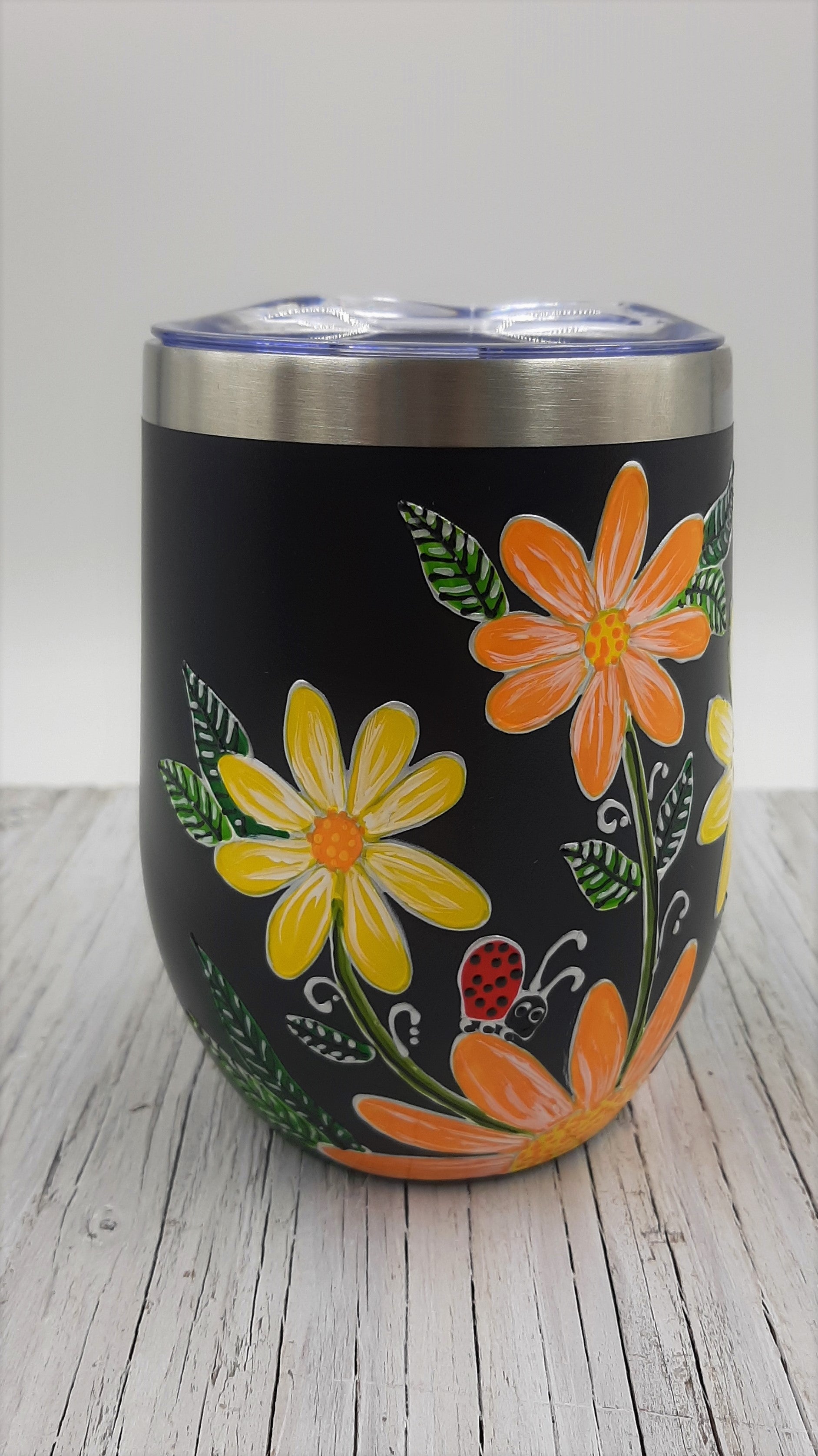 Gobelet isotherme marguerites jaunes et oranges sur fond noir 12oz (355ml)