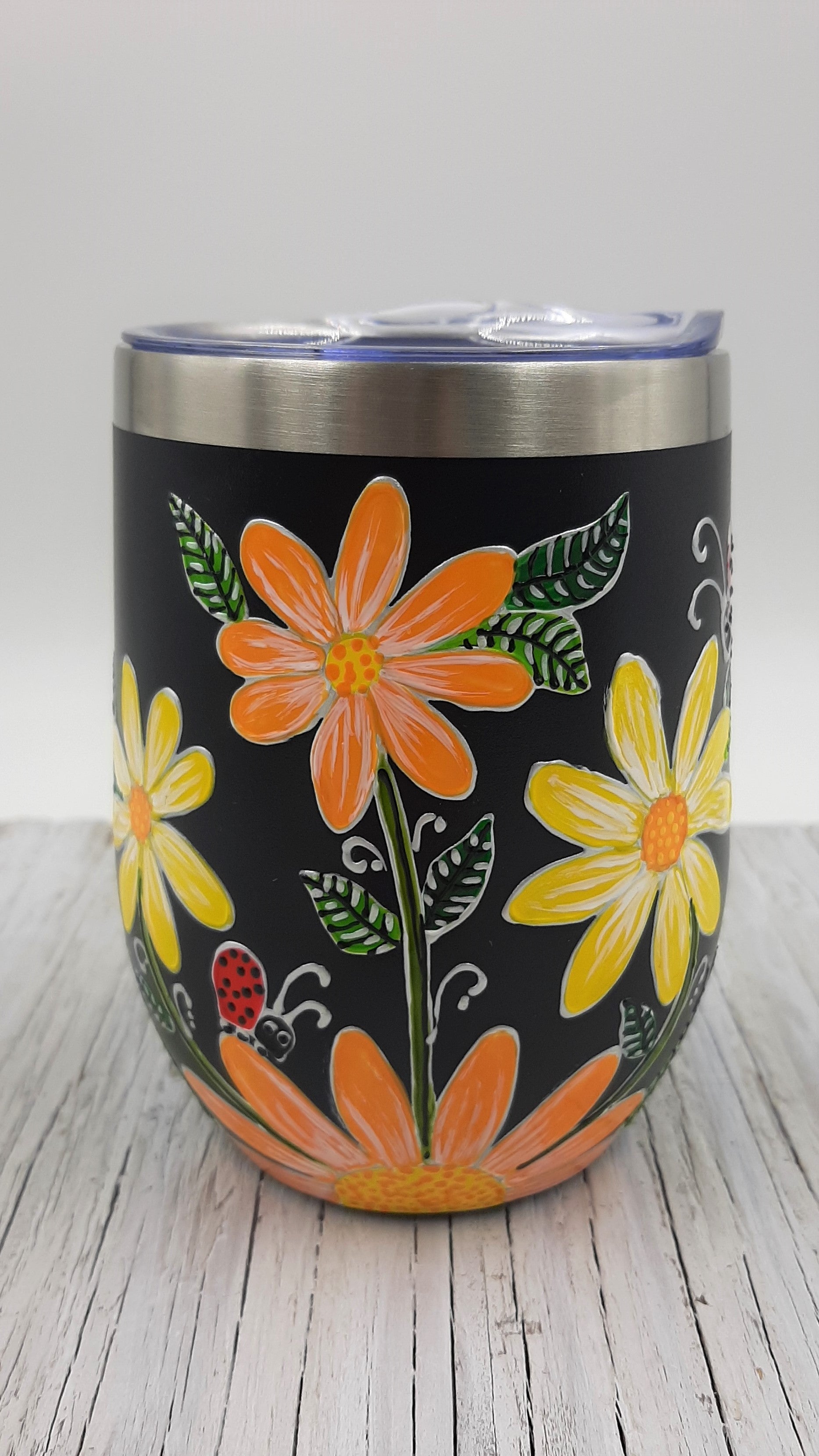 Gobelet isotherme marguerites jaunes et oranges sur fond noir 12oz (355ml)