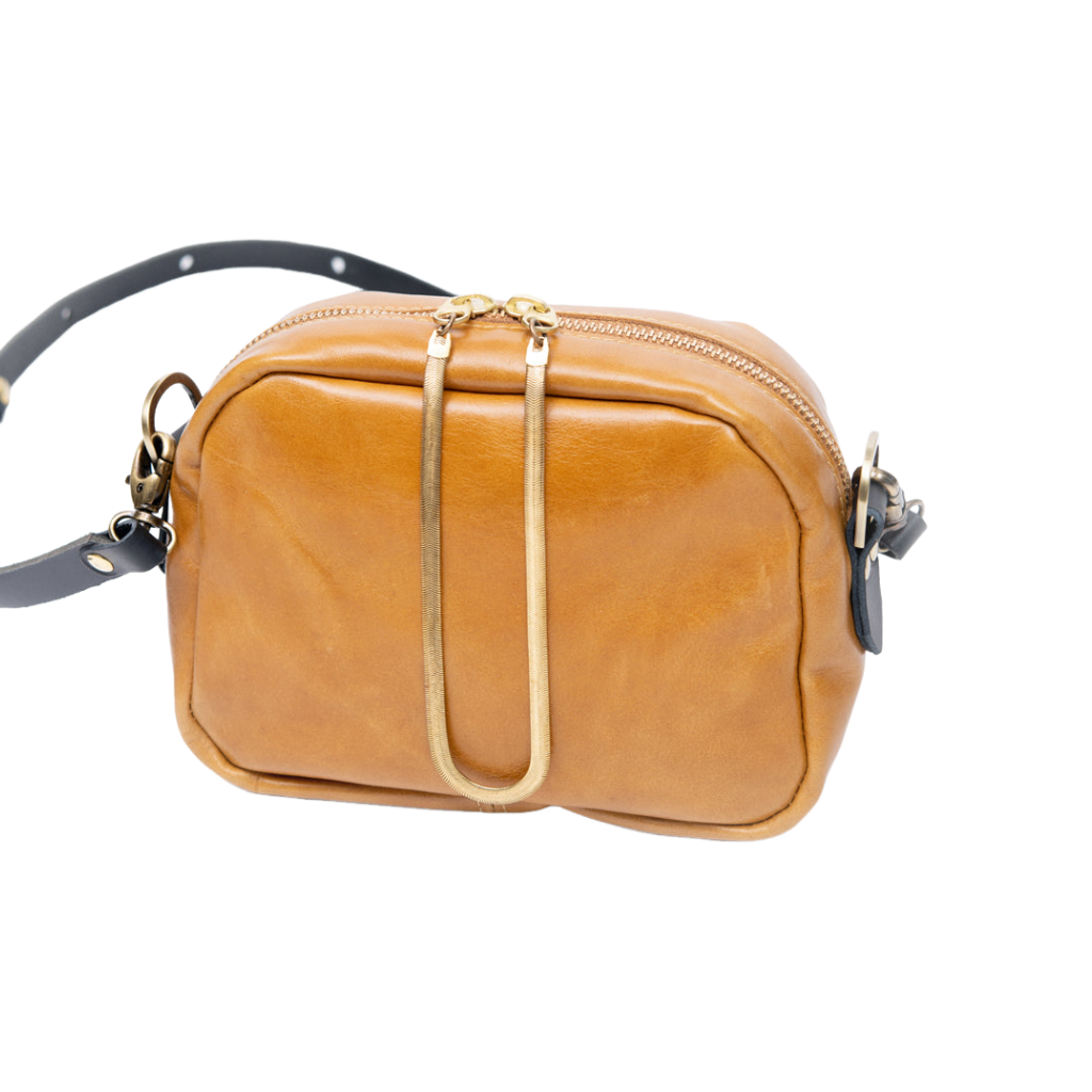 Leather handbag with shoulder strap and brass charm, CARTIER model