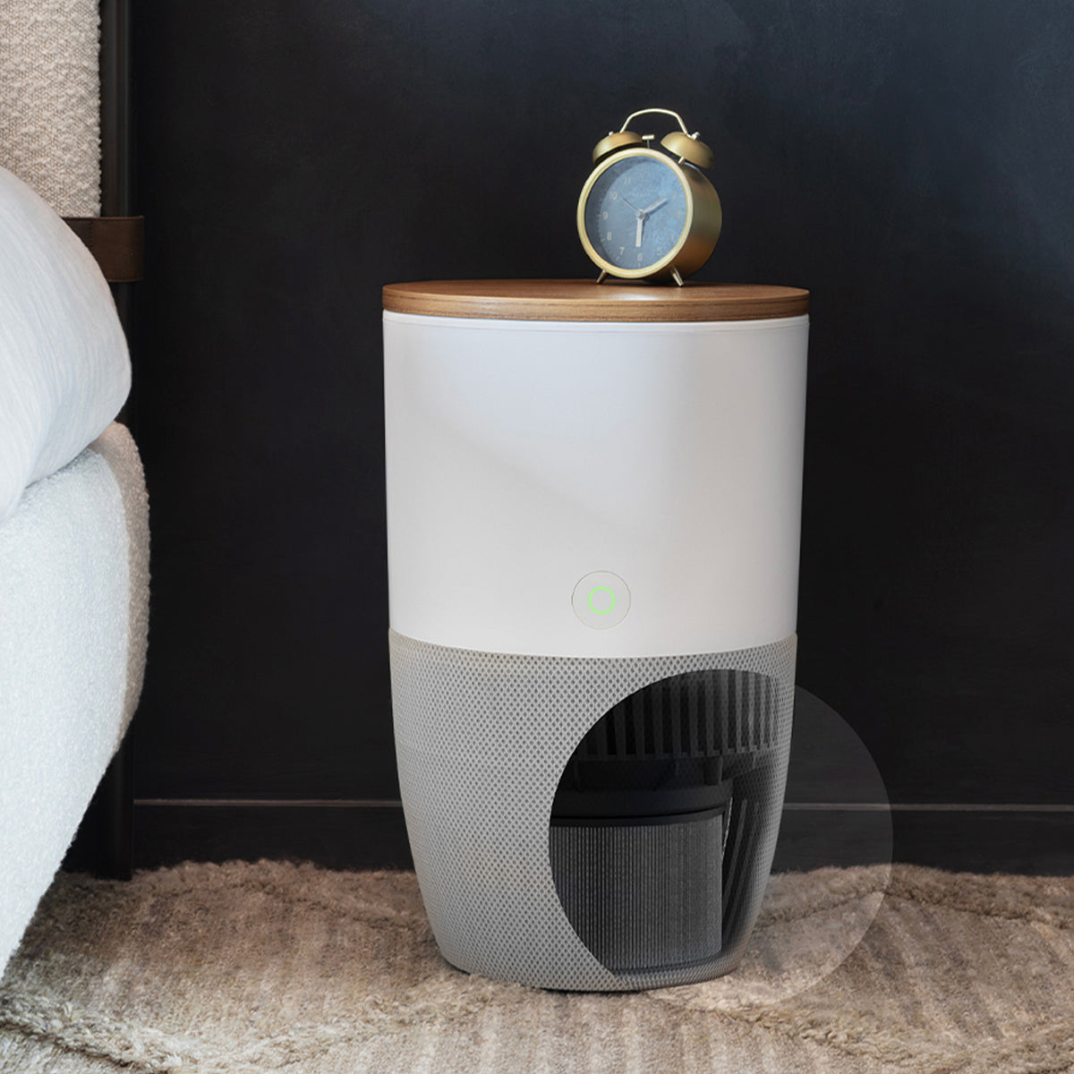 Bloom air purifier with walnut top as a bedside table, with a view of the filter at the base