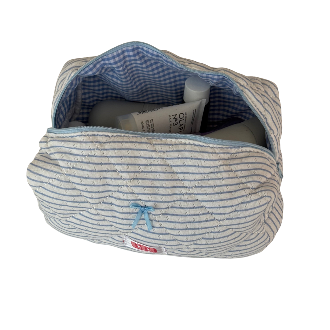 Trousse de maquillage bleu ligné